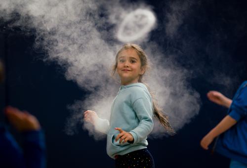 Girl looking at smoke ring from Infinity Blue sculpture